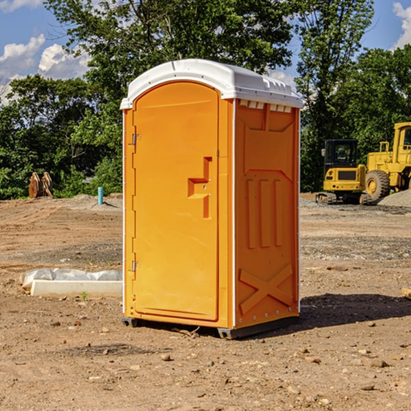 what is the cost difference between standard and deluxe portable toilet rentals in Clermont Iowa